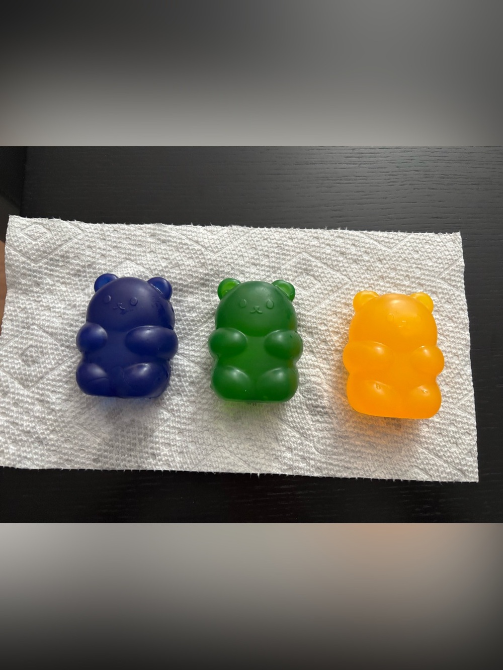 Three squishy bears along with tappa heart squishy pouch